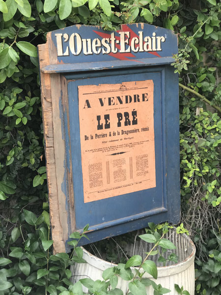 L'Ouest-Eclair Wood Sign